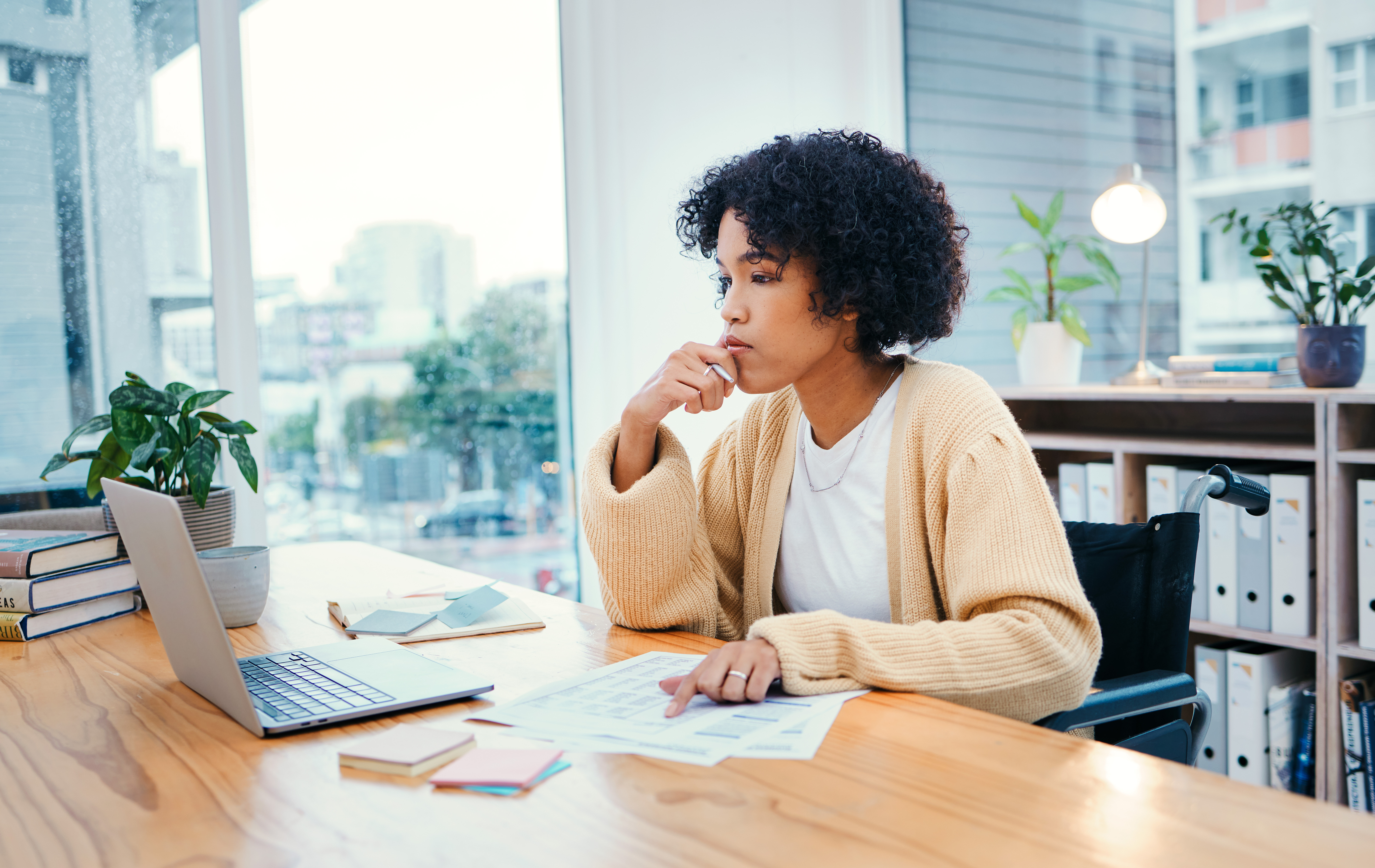Woman looking at laptop