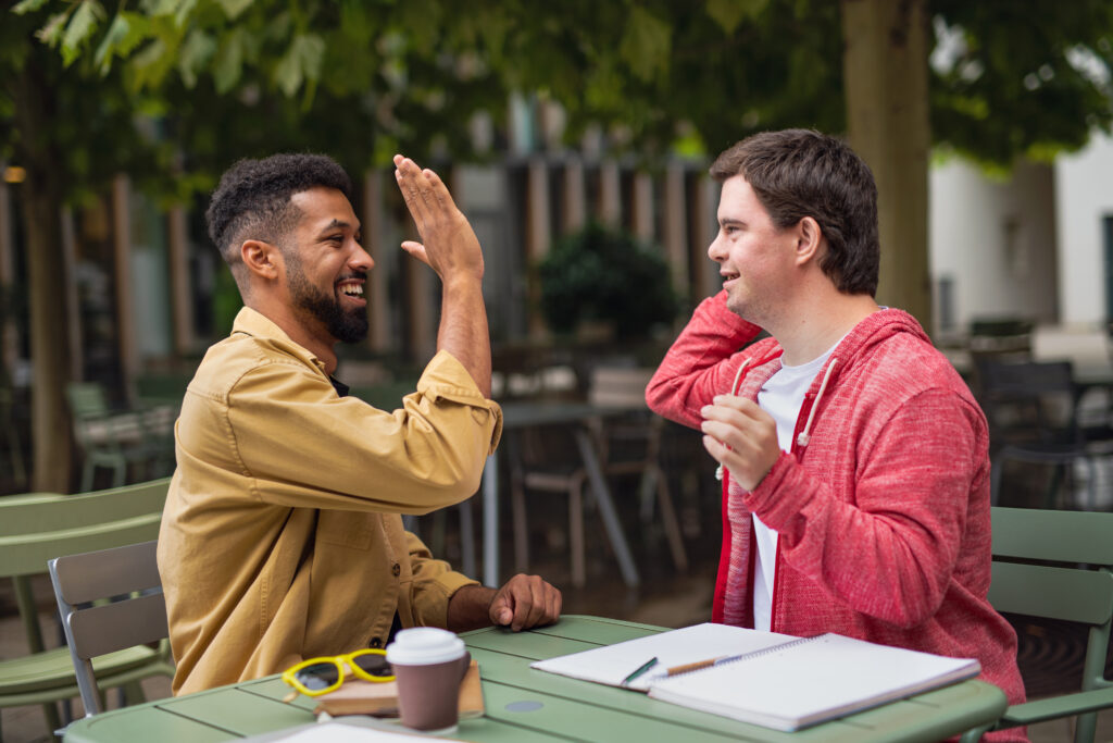 Two men about to high five