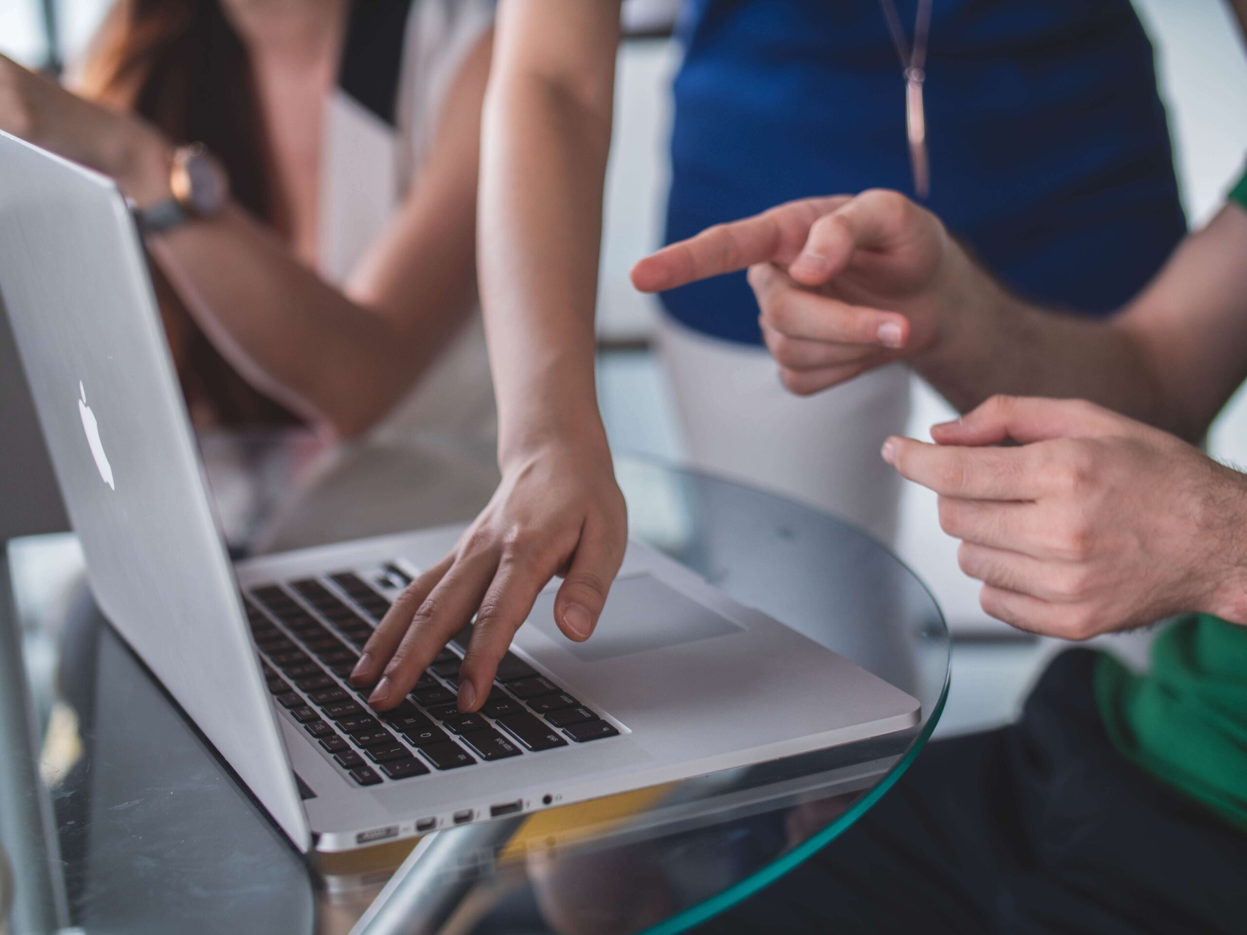 People using cloud-based software on laptop